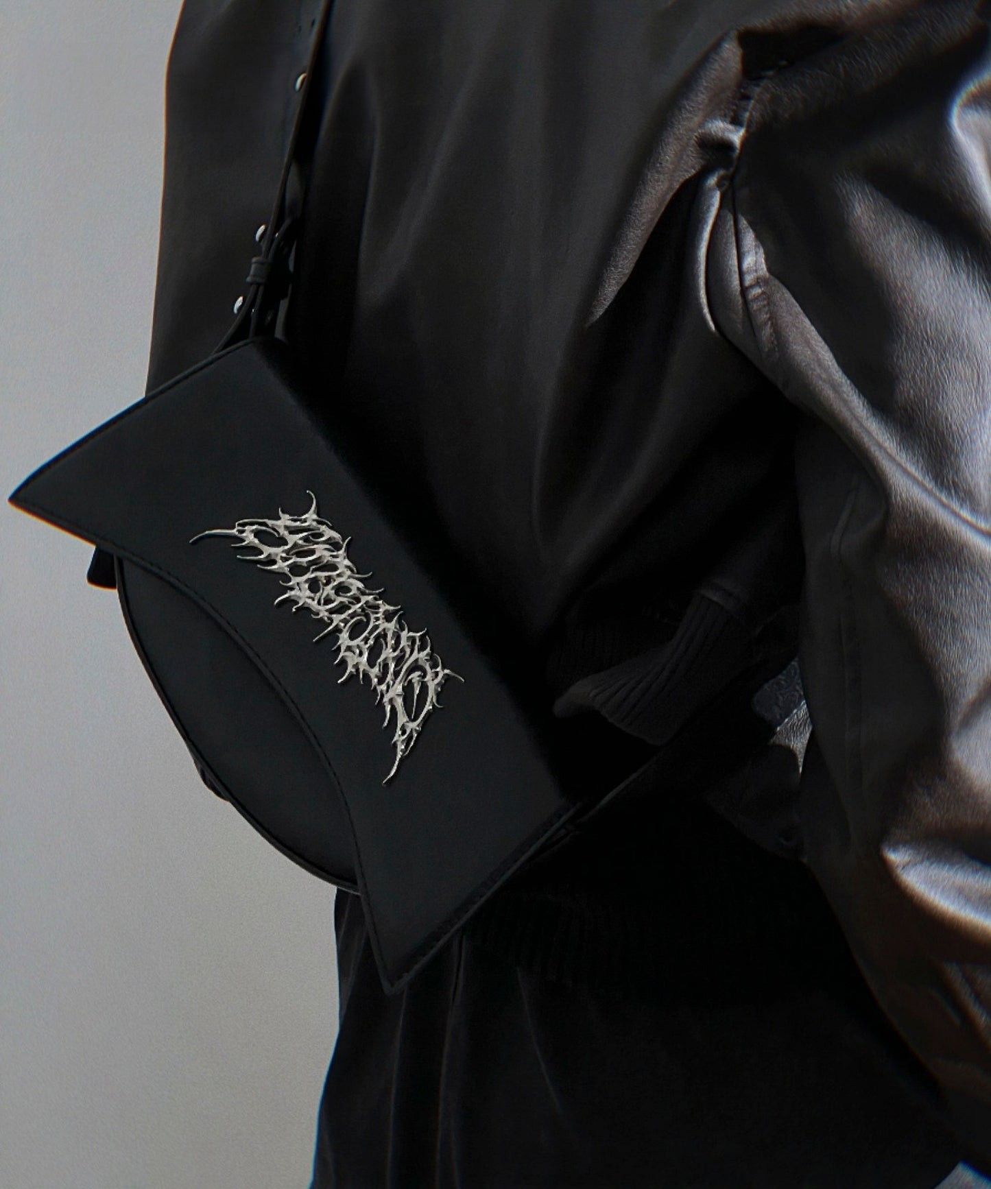 Metal logo shoulder bag