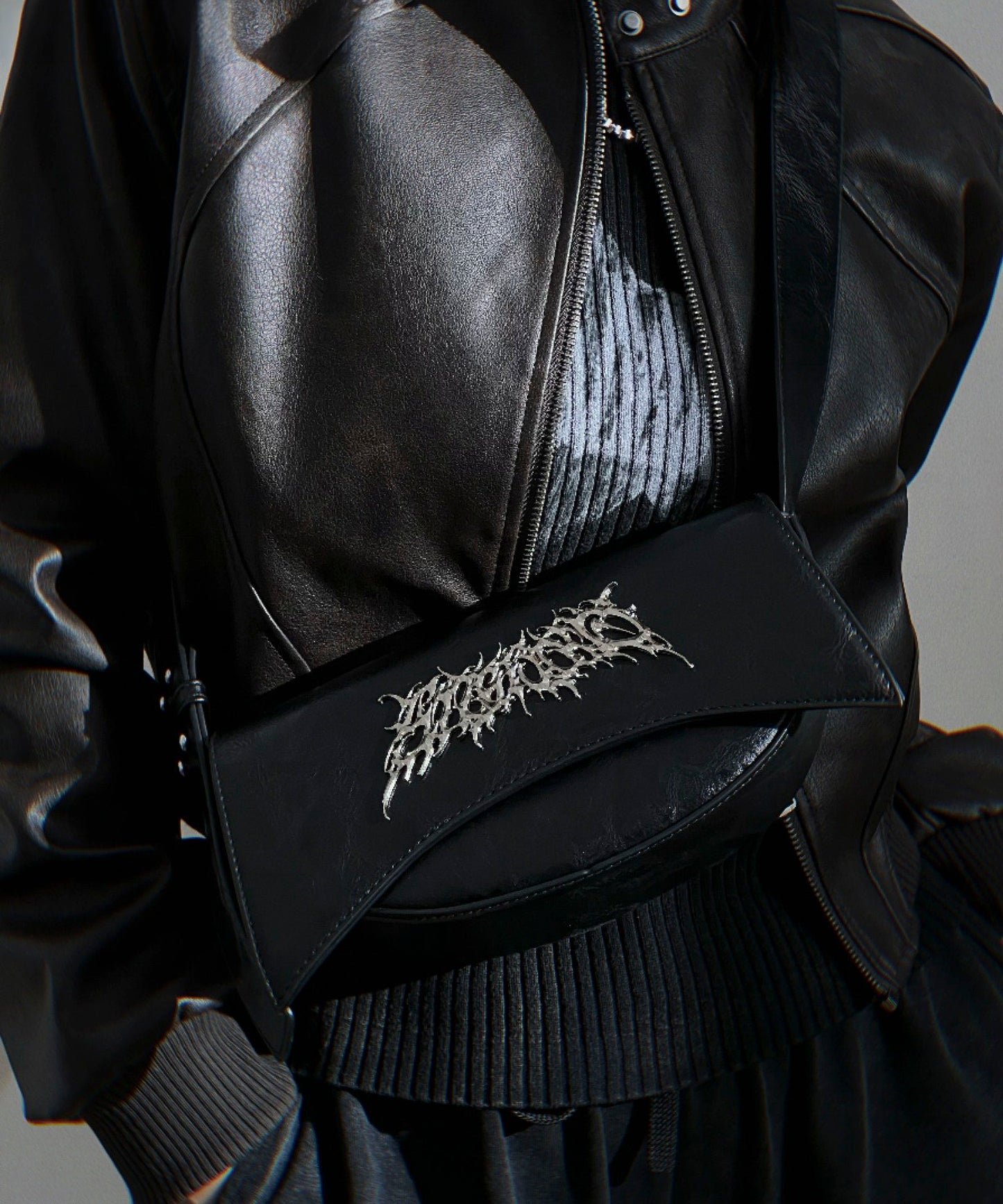 Metal logo shoulder bag