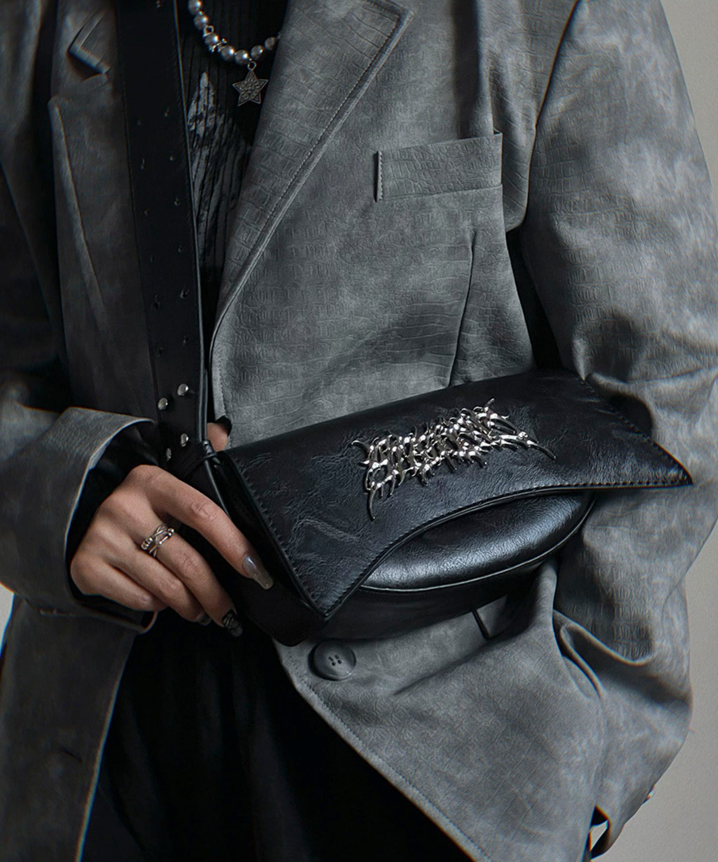 Metal logo shoulder bag