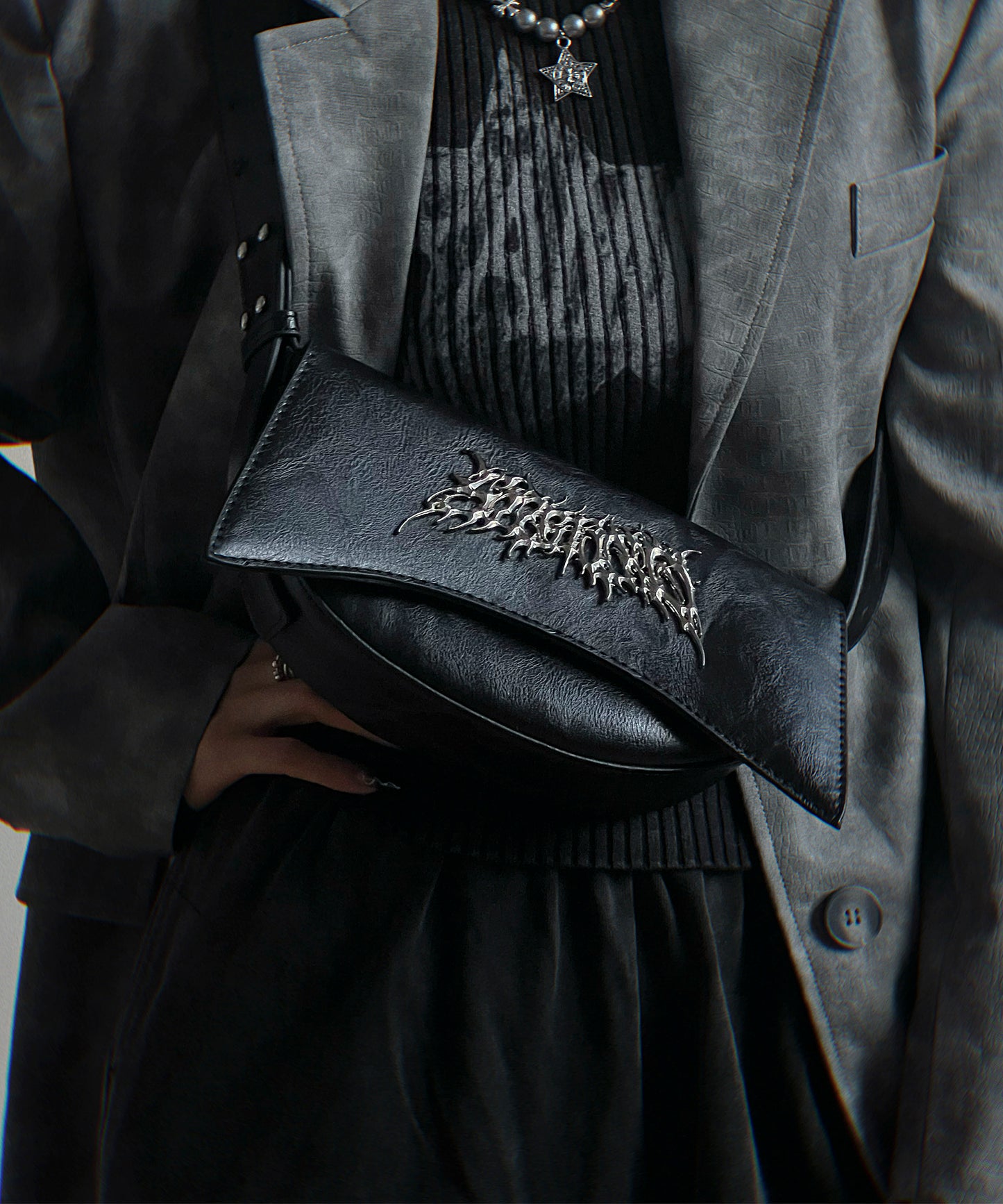 Metal logo shoulder bag