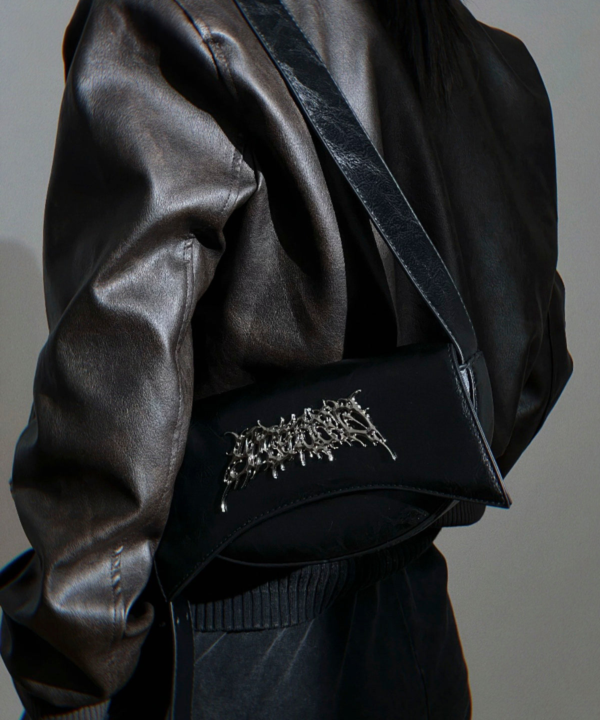 Metal logo shoulder bag