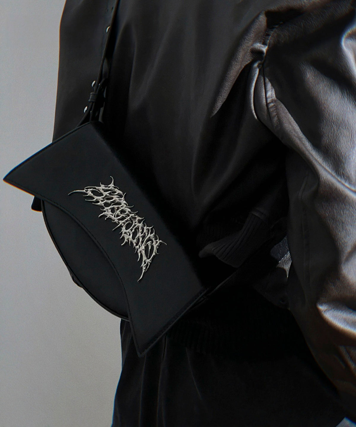 Metal logo shoulder bag